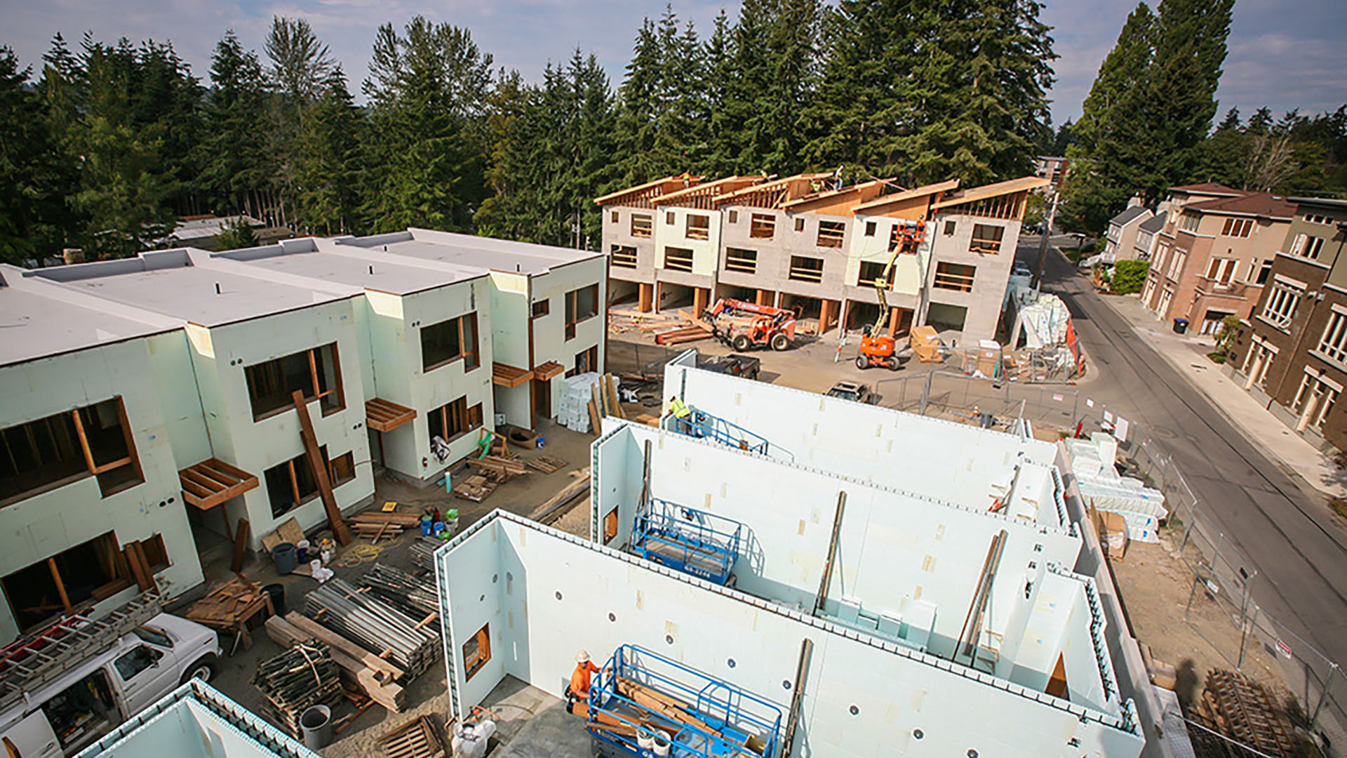 areal view of modern condos being built showcasing different phases of construction