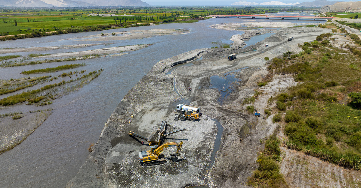 Construction machinery near a river