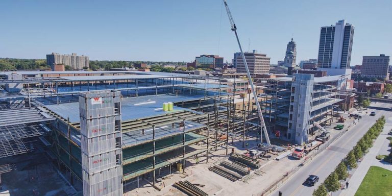 Parking garage under construction in a city.