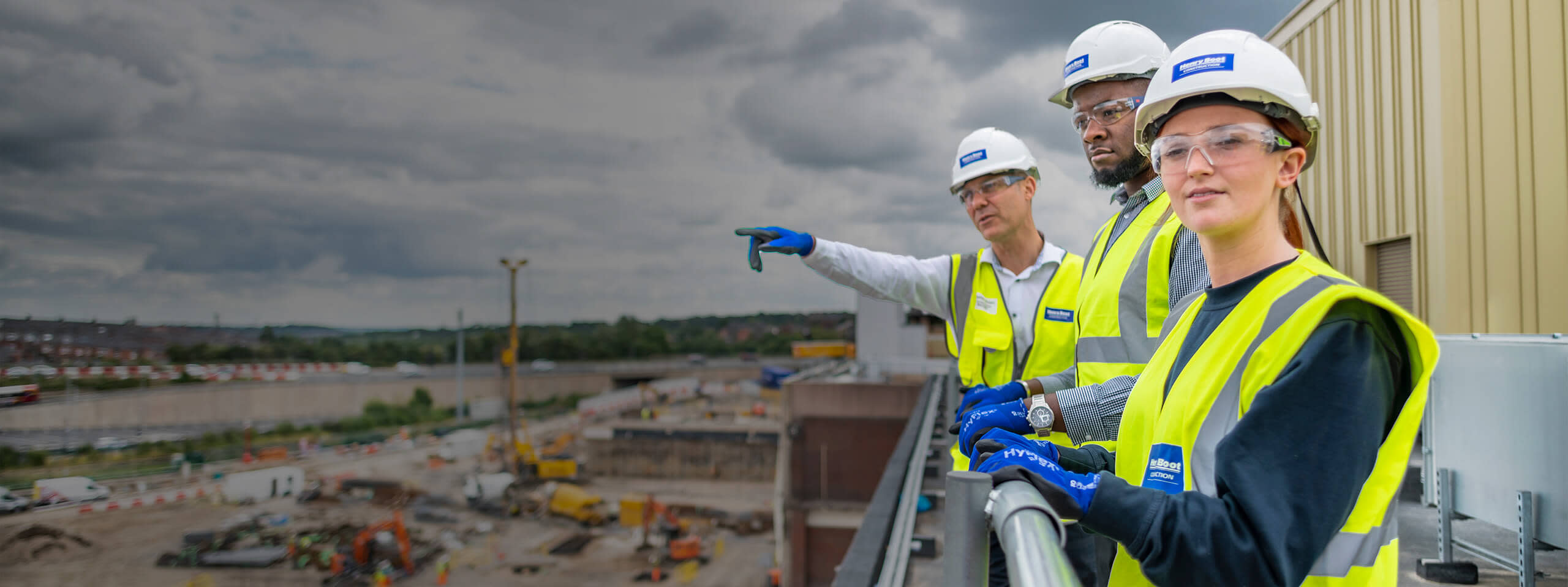 Main contractors standing on a rooftop