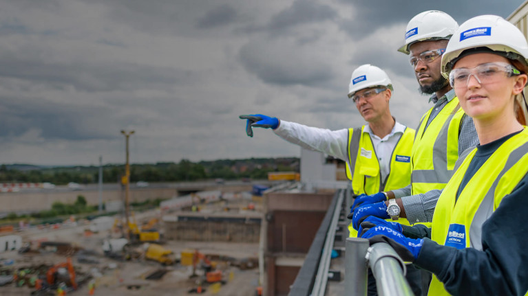 Main contractors standing on a rooftop