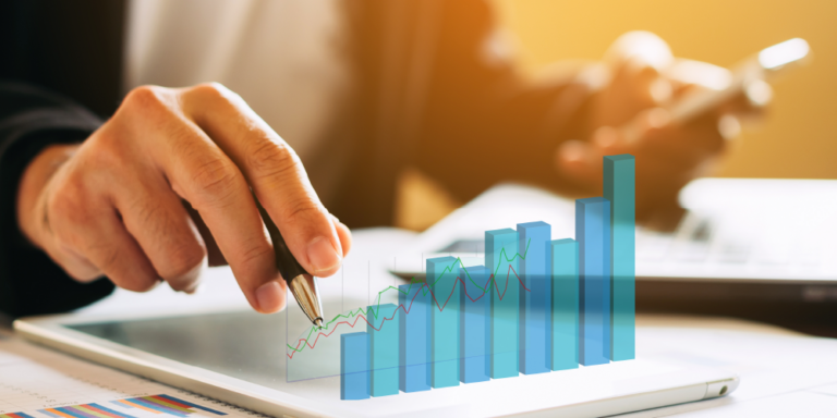 Illustrated bar chart overlaid on person performing financial calculations